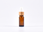 Preview: Braunglasflasche 10ml, mit Lotionspumpe Bambus
