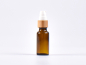 Preview: Braunglasflasche 20ml, mit Lotionspumpe Bambus