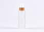 Preview: Glasflasche säuremattiert, 100ml, mit Lotionspumpe Bambus