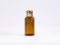 Preview: Braunglasflasche 30ml, mit Tropfmontur Gold