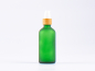 Preview: Grünglasflasche 100ml, mit Lotionspumpe Bambus