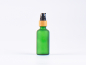 Preview: Grünglasflasche 50ml, mit Lotionspumpe Bambus