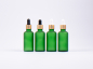 Preview: Grünglasflasche 50ml, mit Pipette gold