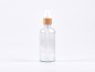 Preview: Klarglasflasche 100ml, mit Lotionspumpe Bambus