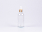 Preview: Klarglasflasche 100ml, mit Pipette gold