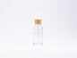 Preview: Klarglasflasche 30ml, mit Pipette gold