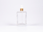 Preview: Klarglasflasche Miro 100 ml - Pipette gold