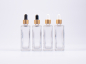 Preview: Klarglasflasche Miro 100 ml - Pipette gold
