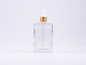 Preview: Klarglasflasche Miro 100 ml - Pipette gold