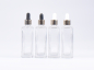 Preview: Klarglasflasche Miro 100 ml - Pipette gold