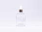 Preview: Klarglasflasche "Miro" 50ml, mit Pipette gold