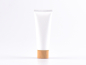 Preview: Kosmetiktube 100ml, weiss-matt, mit Deckel Bambus