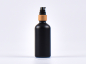 Preview: Schwarzglasflasche 100ml, mit Lotionspumpe Bambus
