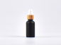 Preview: Schwarzglasflasche 30ml, mit Lotionspumpe Bambus