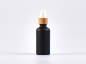 Preview: Schwarzglasflasche 50ml, mit Lotionspumpe Bambus