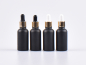 Preview: Schwarzglasflasche 100ml, mit Pipette gold
