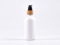 Preview: Weissglasflasche 100ml, mit Lotionspumpe Bambus