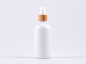 Preview: Weissglasflasche 100ml, mit Lotionspumpe Bambus