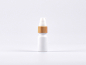 Preview: Weissglasflasche 10ml, mit Lotionspumpe Bambus