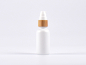 Preview: Weissglasflasche 30ml, mit Lotionspumpe Bambus