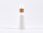 Preview: Weissglasflasche 50ml, mit Lotionspumpe Bambus