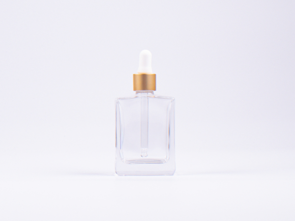 Klarglasflasche "Miro" 50ml, mit Pipette gold
