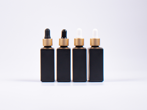 Schwarzglasflasche "Miro" 50ml, mit Pipette gold