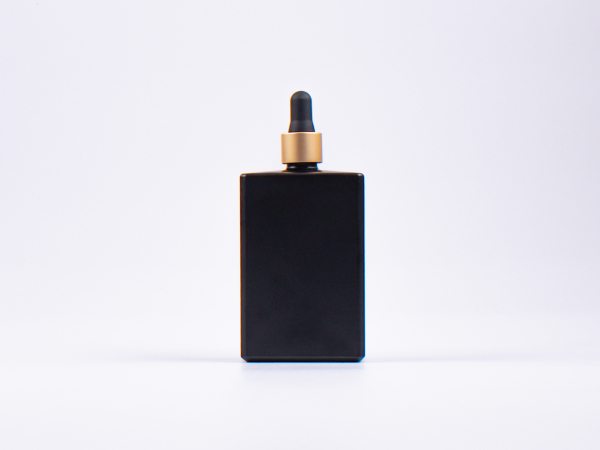 Schwarzglasflasche Miro 100 ml - Pipette gold