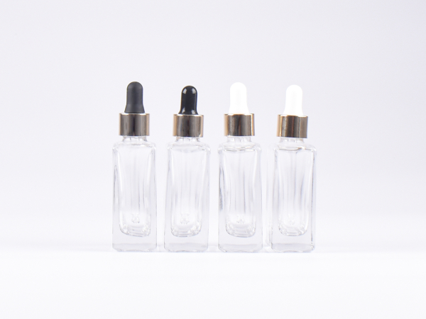 Klarglasflasche "Miro" 50ml, mit Pipette gold