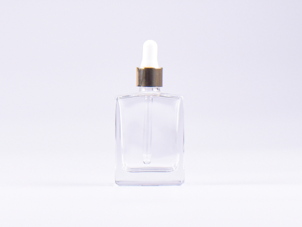 Klarglasflasche "Miro" 50ml, mit Pipette gold