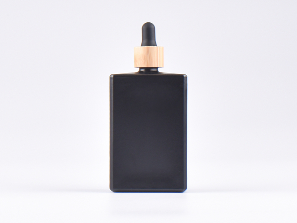 Schwarzglasflasche "Miro" 100ml, mit Pipette Bambus