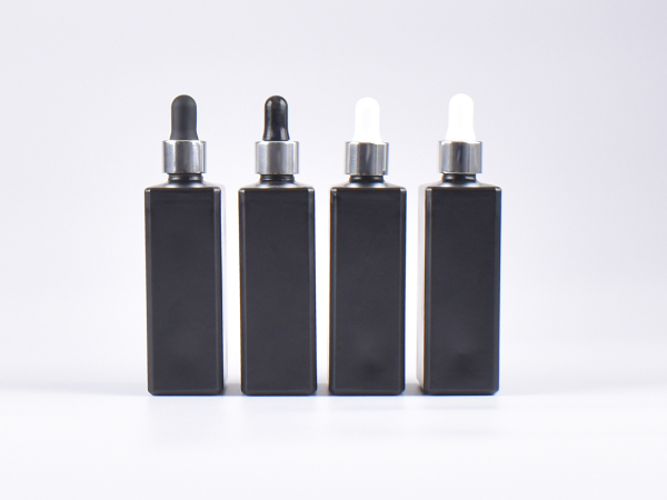 Schwarzglasflasche "Miro" 100ml, mit Pipette silber glanz