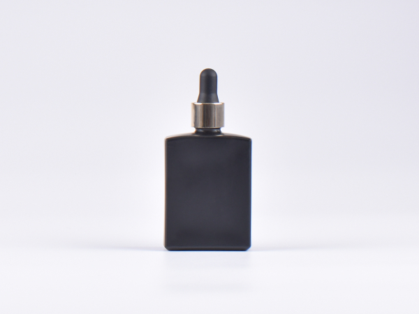 Schwarzglasflasche "Miro" 50ml, mit Pipette gold