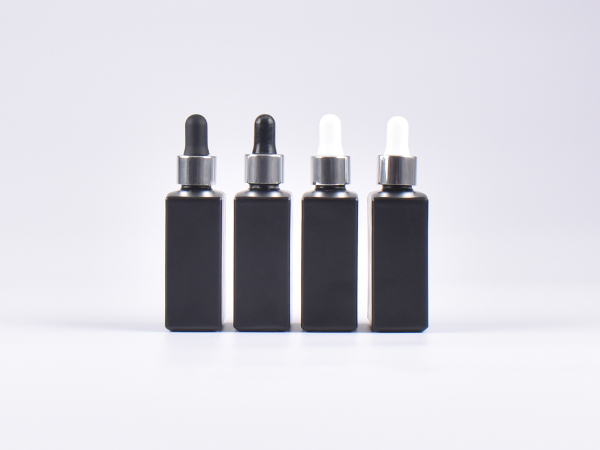 Schwarzglasflasche "Miro" 50ml, mit Pipette silber glanz