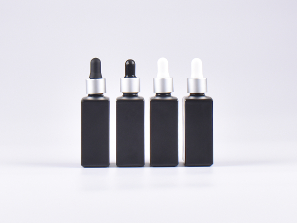 Schwarzglasflasche "Miro" 50ml, mit Pipette silber matt