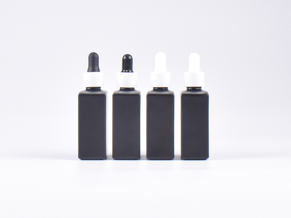 Schwarzglasflasche "Miro" 50ml, mit Pipette weiss