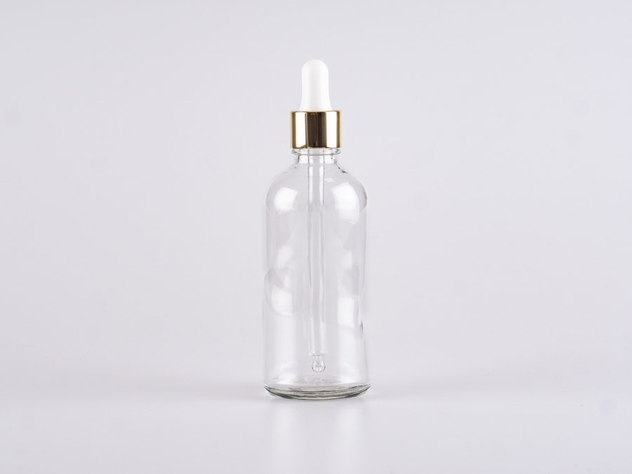 Klarglasflasche 100ml, mit Pipette gold