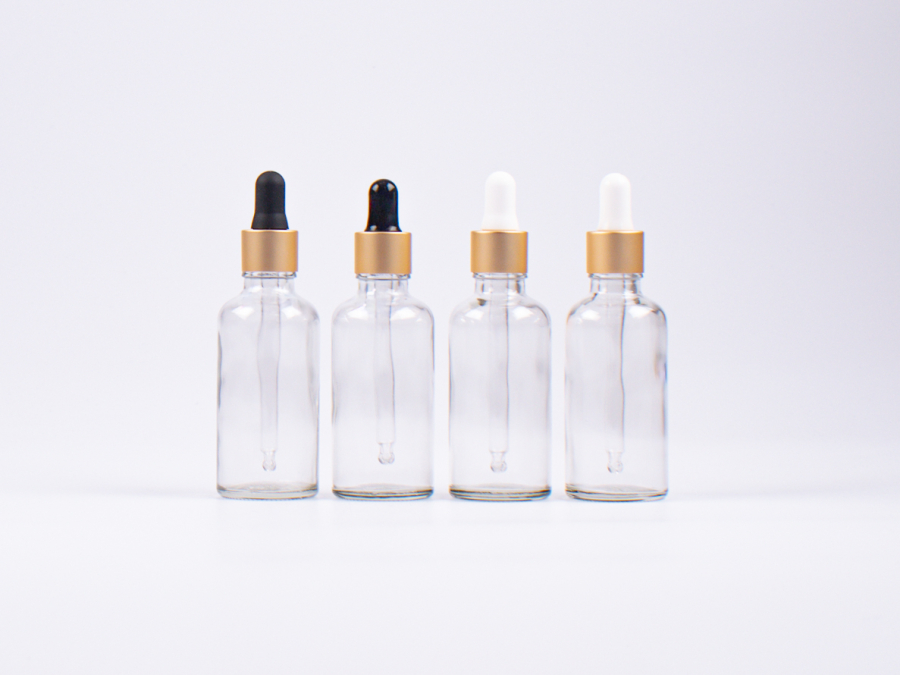 Klarglasflasche 100ml, mit Pipette gold