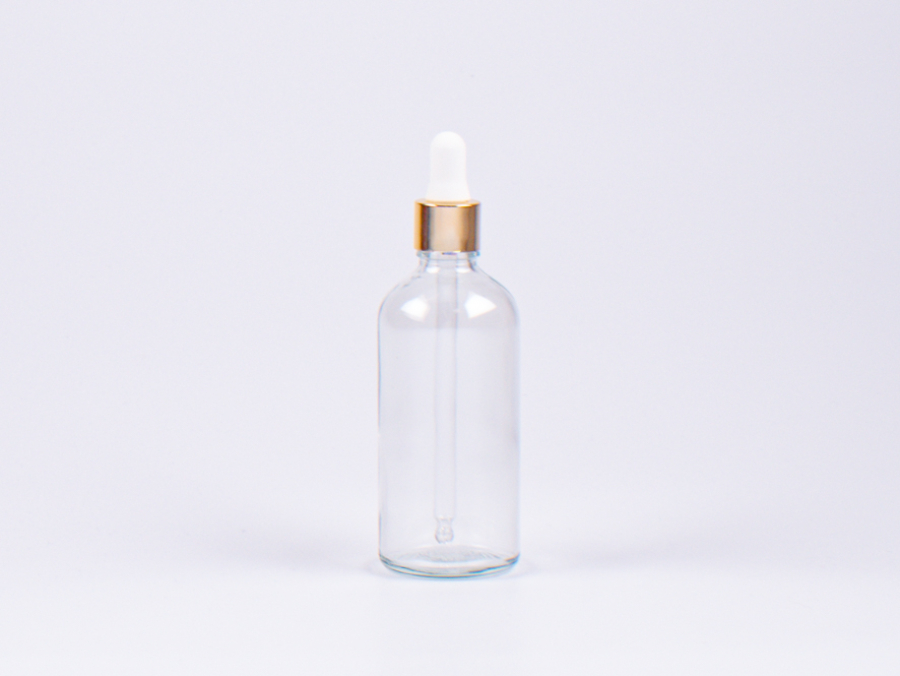 Klarglasflasche 100ml, mit Pipette gold