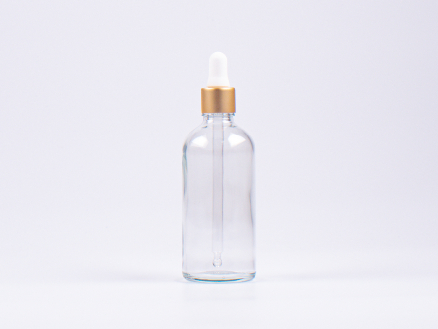 Klarglasflasche 100ml, mit Pipette gold