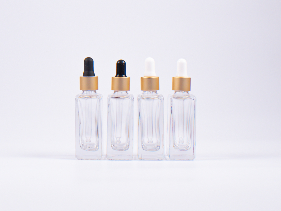 Klarglasflasche "Miro" 50ml, mit Pipette gold