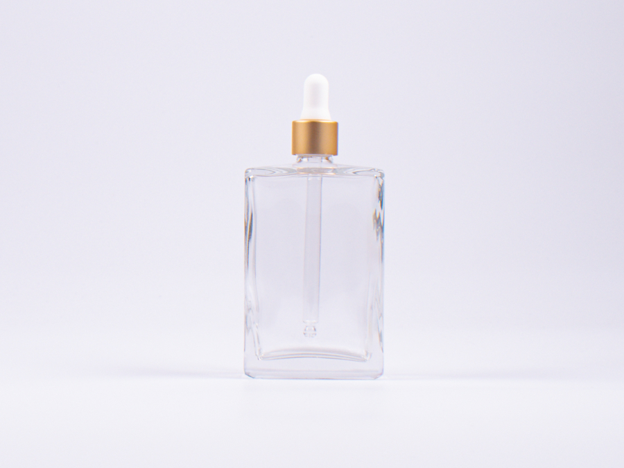 Klarglasflasche Miro 100 ml - Pipette gold