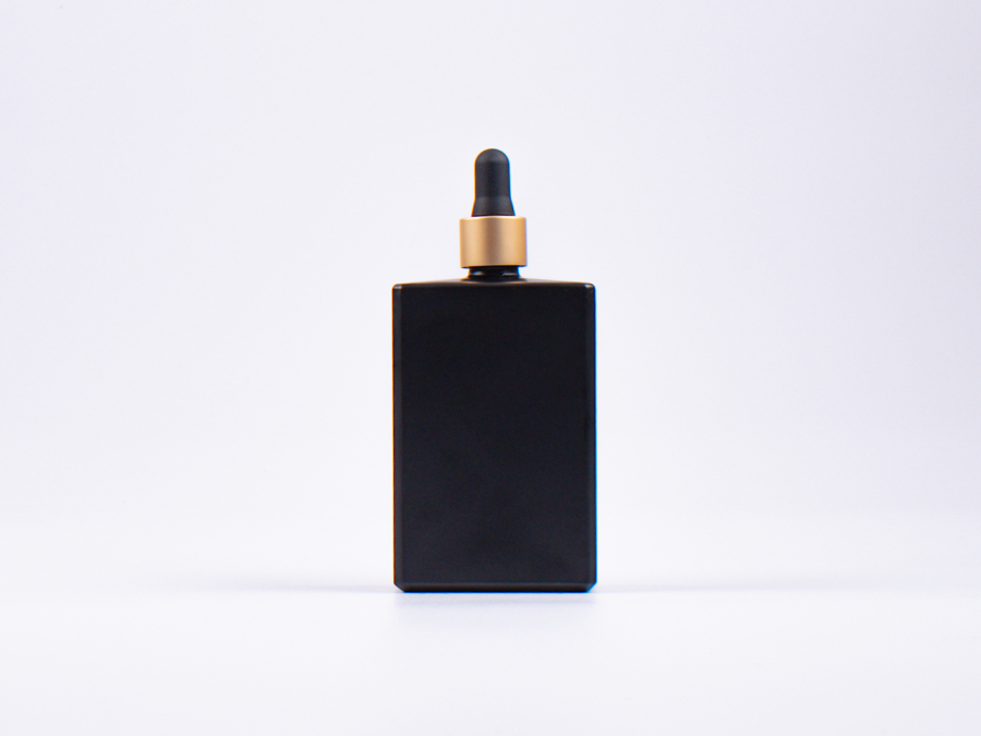 Schwarzglasflasche Miro 100 ml - Pipette gold