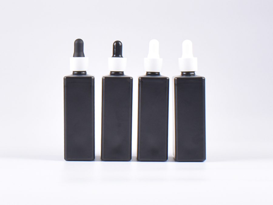 Schwarzglasflasche "Miro" 100ml, mit Pipette weiss