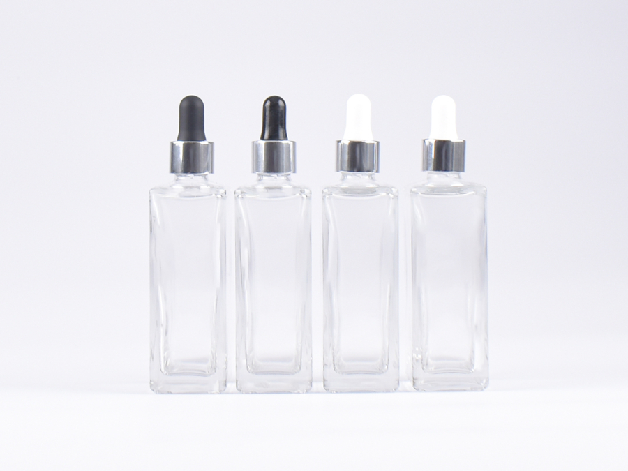 Klarglasflasche "Miro" 100ml, mit Pipette silber glanz