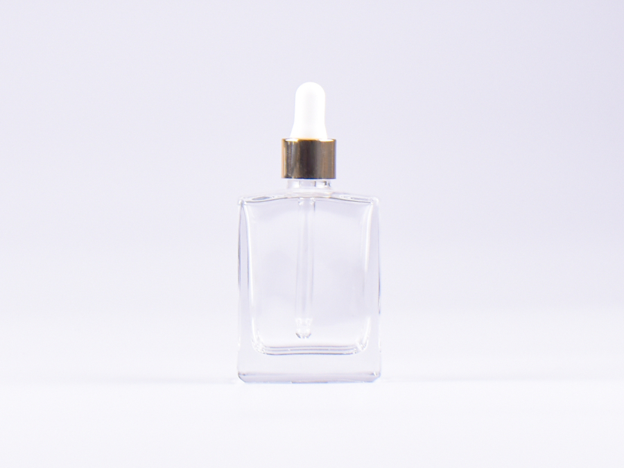 Klarglasflasche "Miro" 50ml, mit Pipette gold