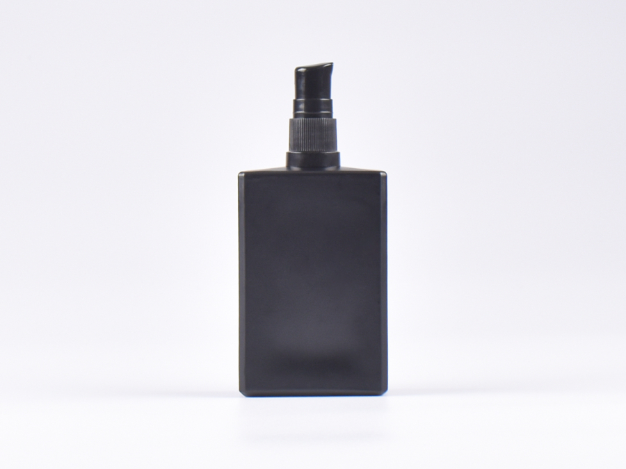 Schwarzglasflasche "Miro" 100ml, mit Lotionspumpe Kunststoff