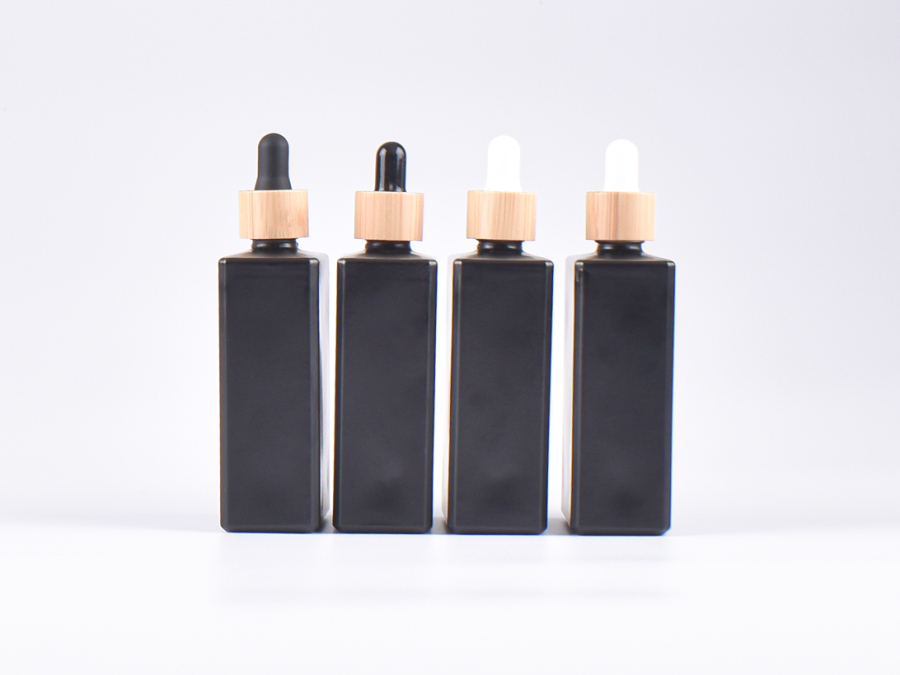 Schwarzglasflasche "Miro" 100ml, mit Pipette Bambus