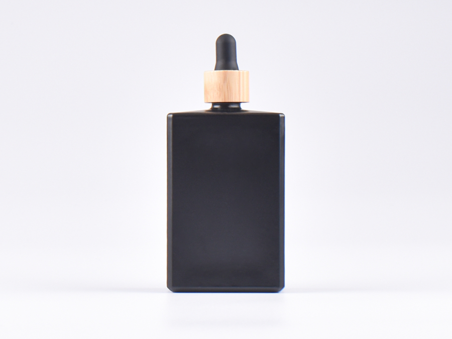 Schwarzglasflasche "Miro" 100ml, mit Pipette Bambus