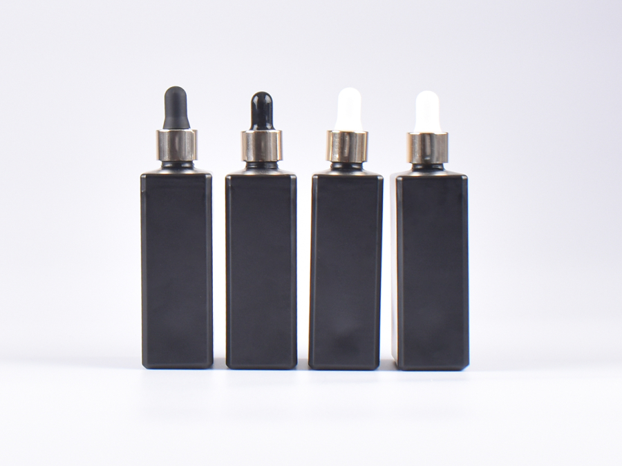 Schwarzglasflasche "Miro" 100ml, mit Pipette gold